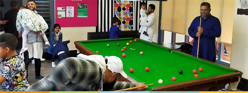 Activities - family playing snooker