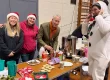 staff and gideon amos serving free drinks at YMCA Festive Fayre
