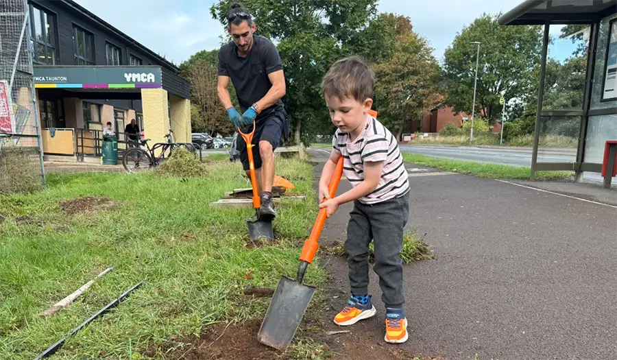 child and adult digging